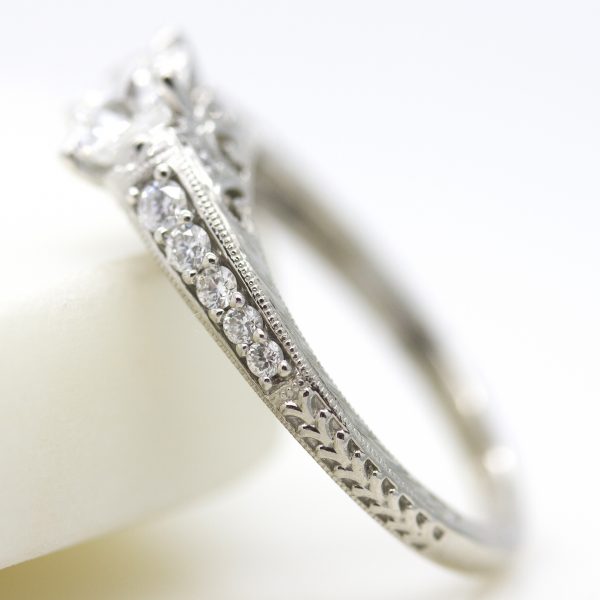 engagement ring with bead set diamond band, milgrain and hand engraving