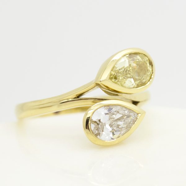 moi et toi engagement ring with yellow and white pear shape diamonds set in yellow gold