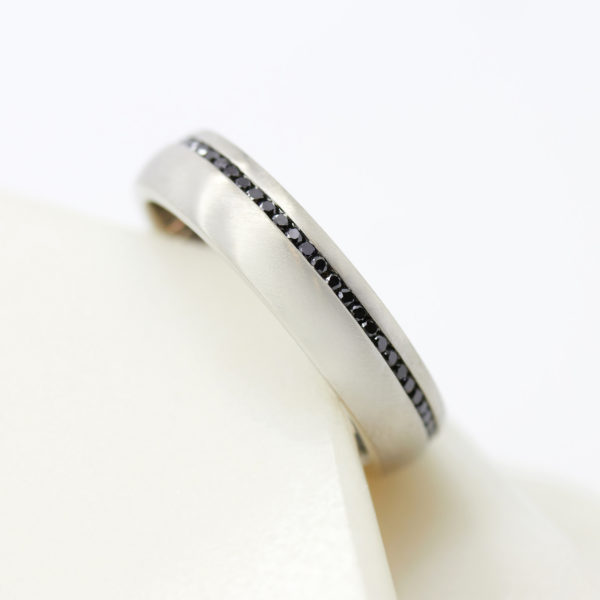 Platinum men's engagement ring with black diamonds