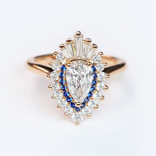 Pear diamond cluster blue sapphire engagement ring